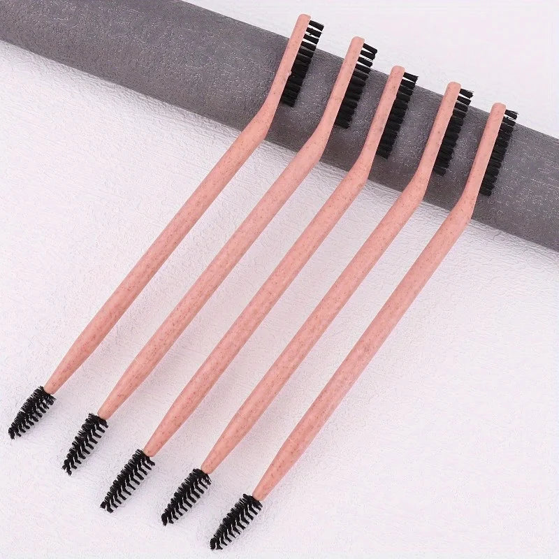 A set of five wooden dual-ended eyelash curlers and brow brushes arranged diagonally on a white surface.