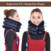 A woman wearing a dark blue inflatable cervical neck traction pillow for pain relief.