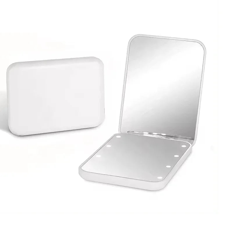 A white mini folding makeup mirror with an LED light, shown open and closed.