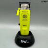A yellow SmartBrain digital brushless electric hair clipper with a black base.