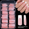 A set of nude pink matte French tip press-on nails displayed on a clear plastic tray and on a hand.