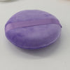 A round, purple jumbo soft powder puff with a purple band for makeup application.