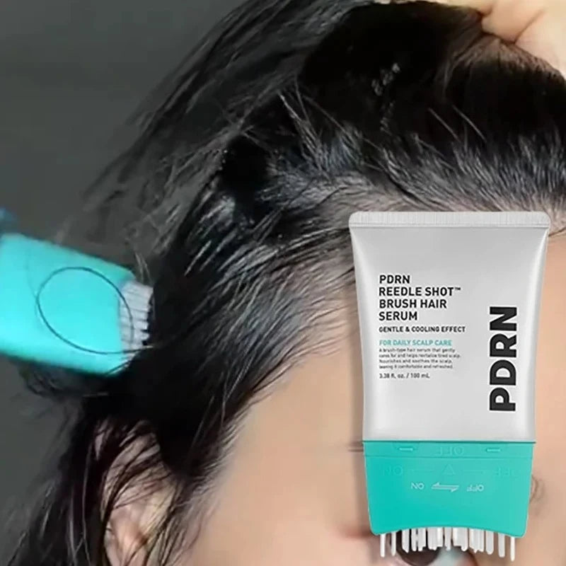 A tube of PDRN Reedle Shot Brush Hair Serum for daily scalp care is shown next to a black hair, with a brush visible in the b
