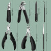 A set of professional stainless steel nail clippers in black and silver, shown with various sizes.