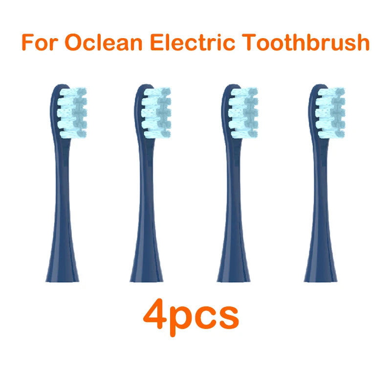 Four replacement brush heads for an Ocean electric toothbrush are shown.