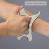 A hand holds a medical grade stainless steel gua sha tool against the skin for massage or pain relief.