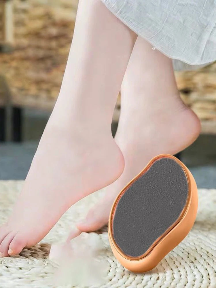 A close-up of a portable glass foot file and callus remover tool resting on a woven mat.