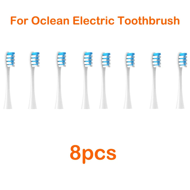 Eight replacement brush heads for an Ocean electric toothbrush are displayed.