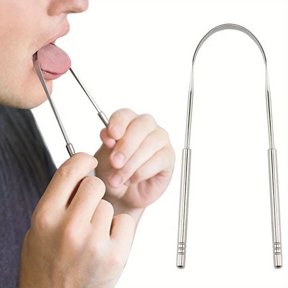 A hand uses a stainless steel U-shaped tongue scraper to clean the tongue.