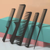 A set of black multifunctional hair detangler comb brushes displayed on a light surface.