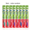 Eight packs of Colgate gentle manual toothbrushes with random colors displayed in a row.