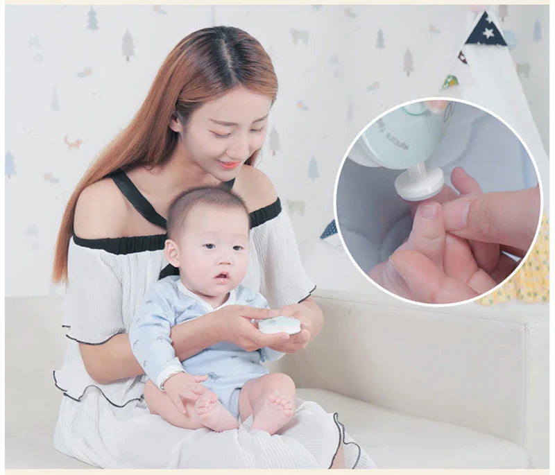 A woman gently shows a baby how to use an electric nail trimmer on their finger.