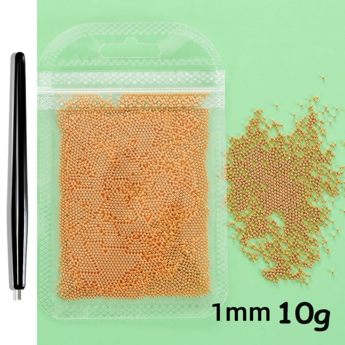 A clear plastic bag contains 10 grams of gold mixed stainless steel bead nail art decorations, measuring 1mm in size.