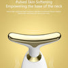 A close-up of a white electric facial massager device with a gold accent, showing its head and body.