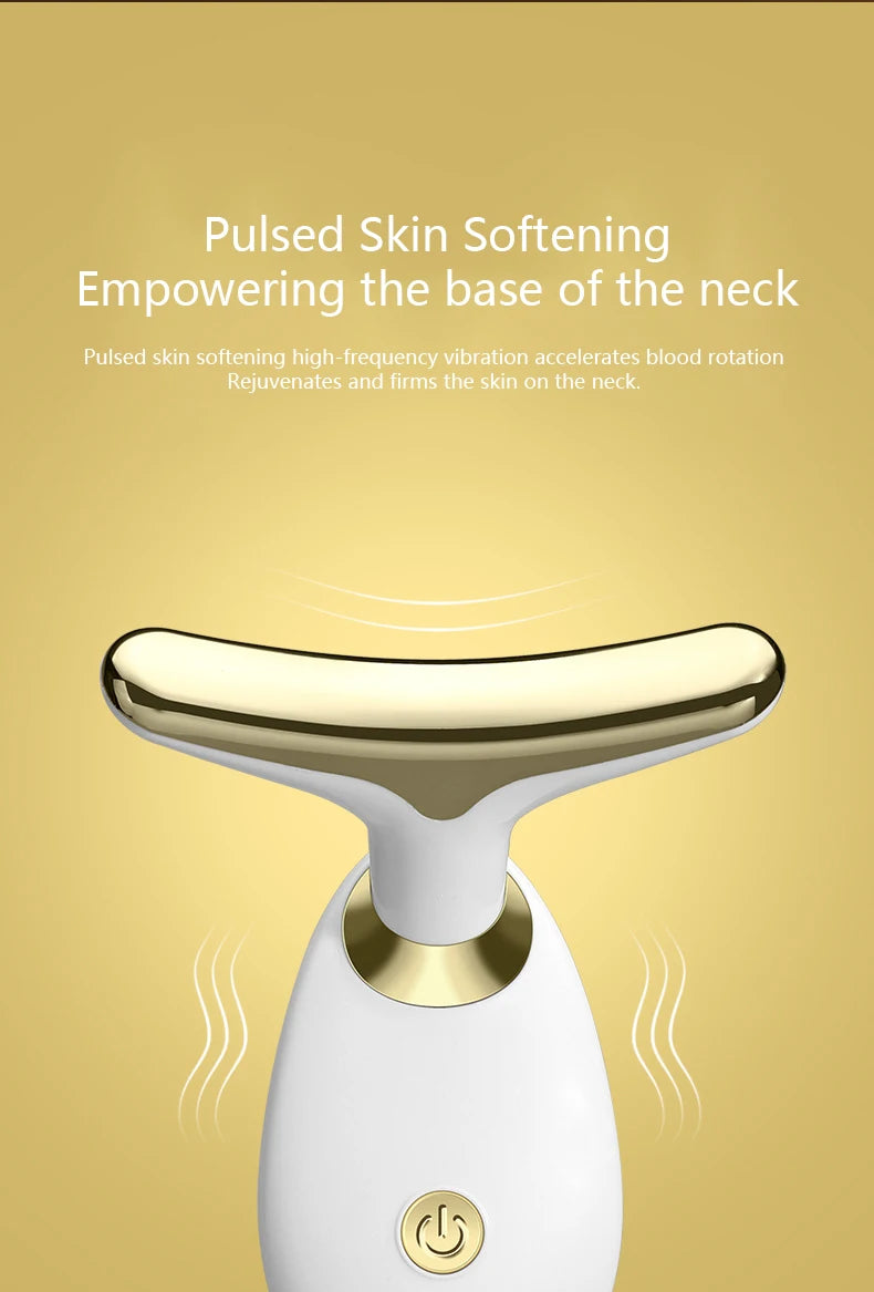 A close-up of a white electric facial massager device with a gold accent, showing its head and body.