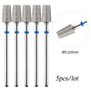 A set of five silver diamond nail drill bits with blue accents, sold in a lot.