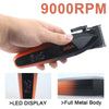 A hand holds an orange and black cordless hair trimmer with a display, showing its full metal body.