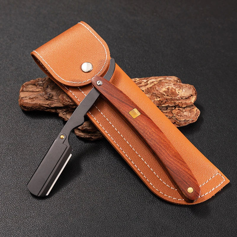 A professional wood handle shaving razor with a tan leather sheath and dark wood handle resting on a black surface.