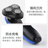 A black electric shaver head and body with blue accents, showing a close-up view of the shaving device.