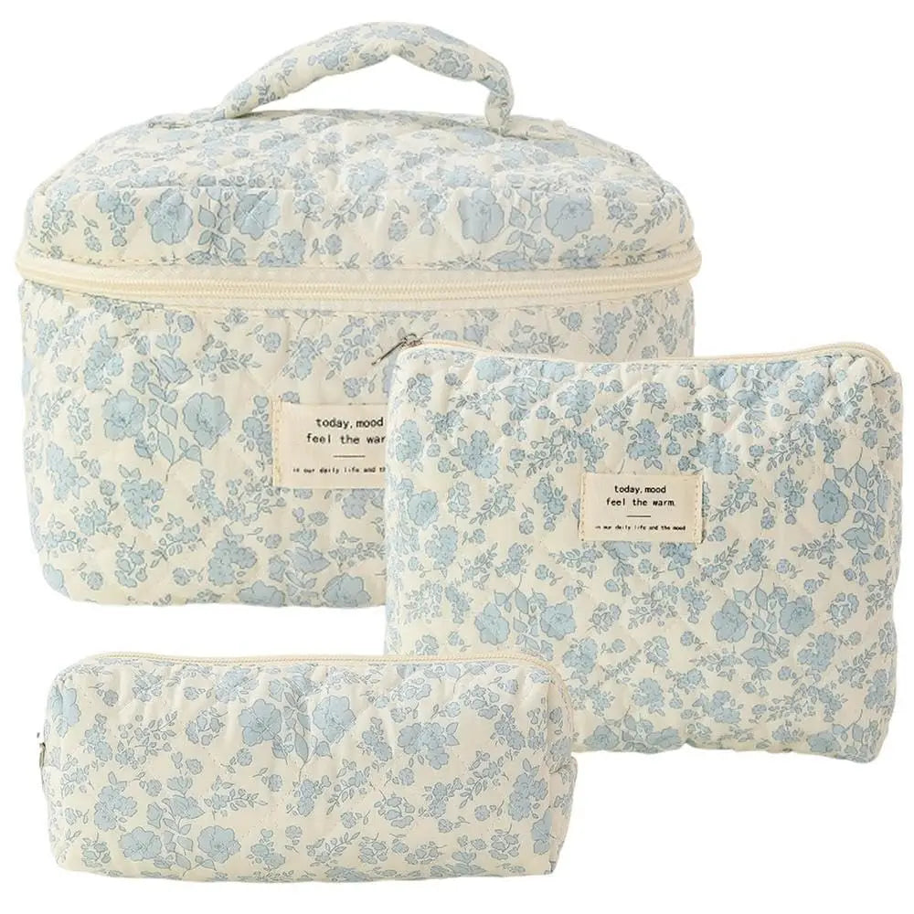 Light blue floral quilted cotton makeup bag with zipper closure