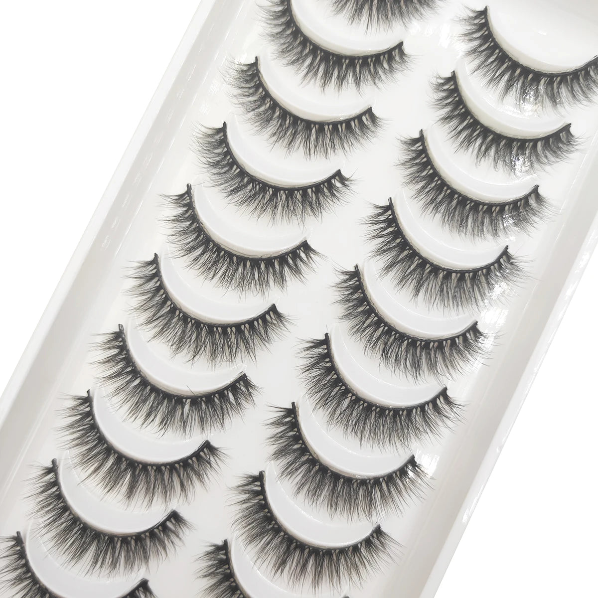 A tray of natural 3D mink false eyelashes displayed for cosmetic use.