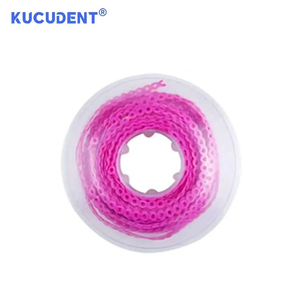 Pink dental orthodontic power chain elastic rubber band coiled on a clear plastic disk