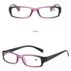 A pair of black and purple frame reading glasses shown in a straight-on view.