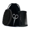 A black boar bristle beard brush and comb set displayed inside a black fabric gift bag.