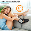 A woman is using a black ankle foot massager on her leg while relaxing on a couch.