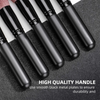 A set of professional makeup brushes with smooth black metal handles displayed on a dark surface.