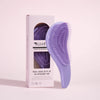 A purple anti-static detangling comb with scalp massage tips is shown next to its packaging box.
