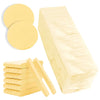 A collection of yellow compressed facial sponges, including a large block and several circular discs.