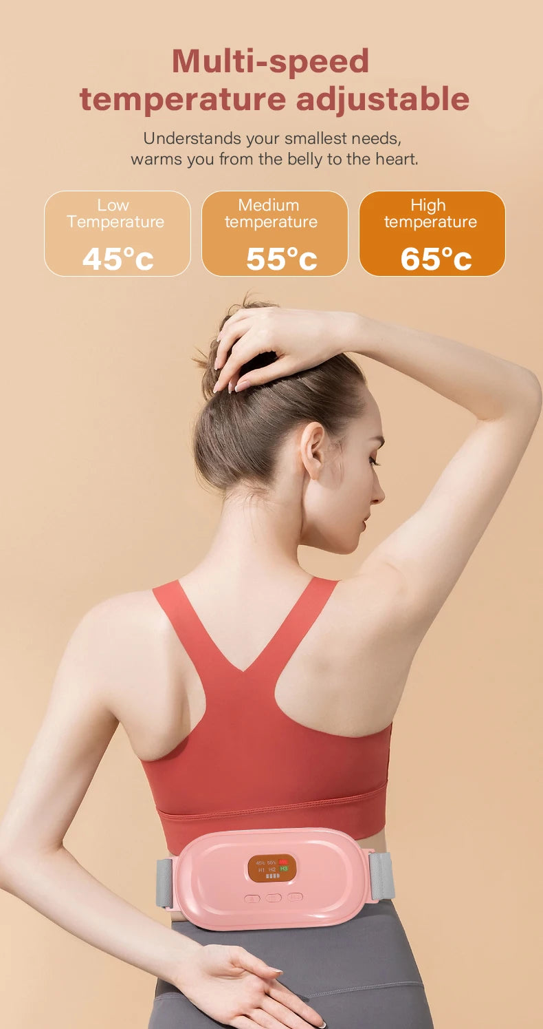 A woman wearing a pink heated abdominal massage belt is shown adjusting the temperature settings.
