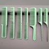 A set of seven light green professional hair styling combs displayed in a row.