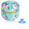 Boîte à poudre de maquillage ronde, bleu sarcelle et rose, avec une mèche blanche amovible.