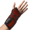 A hand wearing a dark orange wrist support with a black control panel.