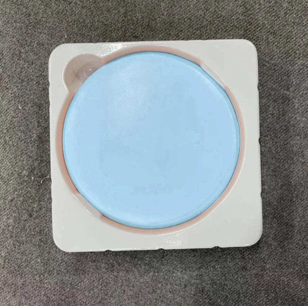 A round, light blue LED makeup mirror with a white frame is shown on a gray fabric surface.