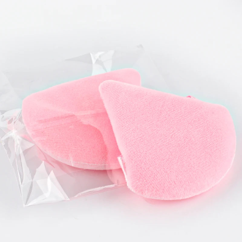 A pink reusable velvet powder puff set packaged in clear plastic.