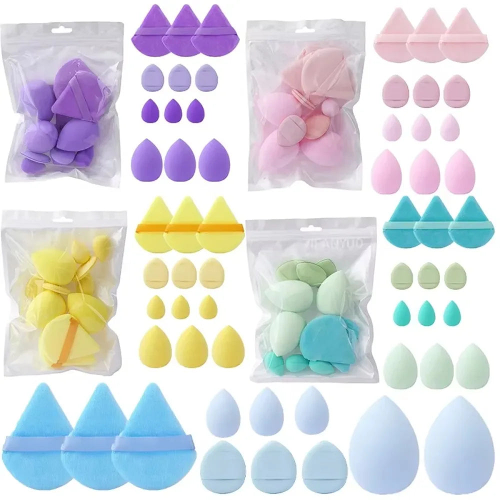 Una colección de 12 esponjas de maquillaje de colores pastel en varias formas y tamaños.