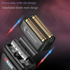 Close-up view of a black electric hair shaver with removable and detachable blade mesh designs.