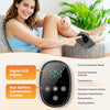 A woman is using a portable heated vibration ankle massager on her leg while relaxing.