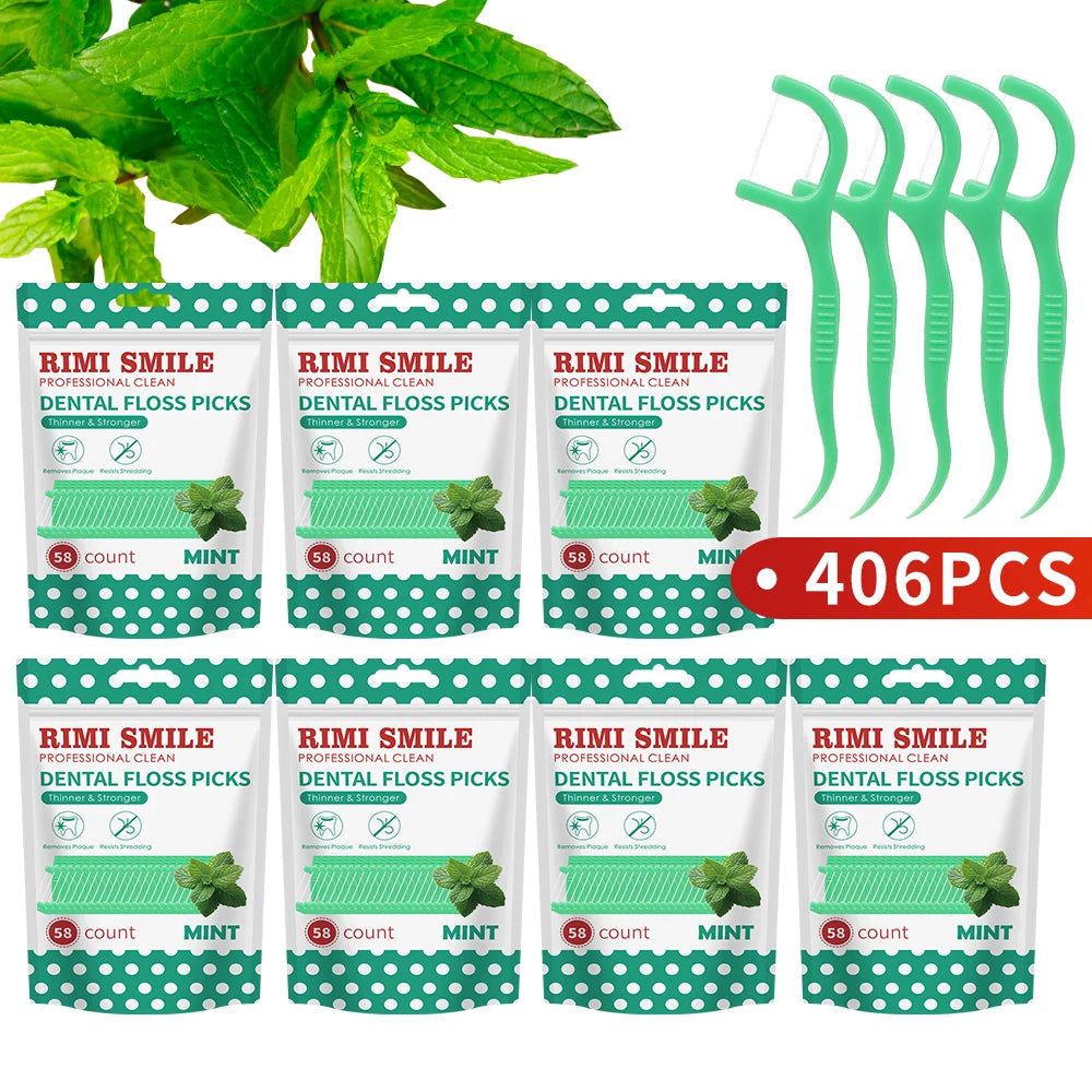 A set of green mint flavor dental floss picks packaged in a clear plastic case.
