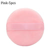 Pink makeup puffs with a pink elastic band for concealer and powder application