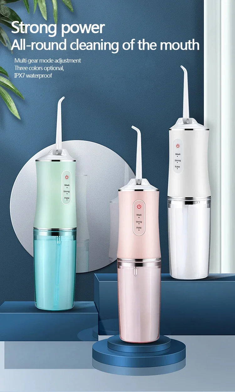 A white portable oral irrigator device shown in various colors on a stand.