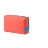 A rectangular makeup bag in coral pink and bright blue color block design.