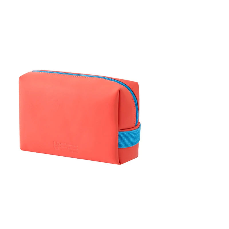 A rectangular makeup bag in coral pink and bright blue color block design.