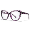 Purple and white patterned clear cateye reading glasses with a tortoiseshell frame