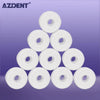 A stack of white mint flavored dental floss spools.