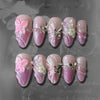 Set vergoldeter Mandelblüten-Press-on-Falschnägel in Pink und Weiß-Glitzer.