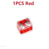A single red dual pencil sharpener for cosmetics and art supplies.